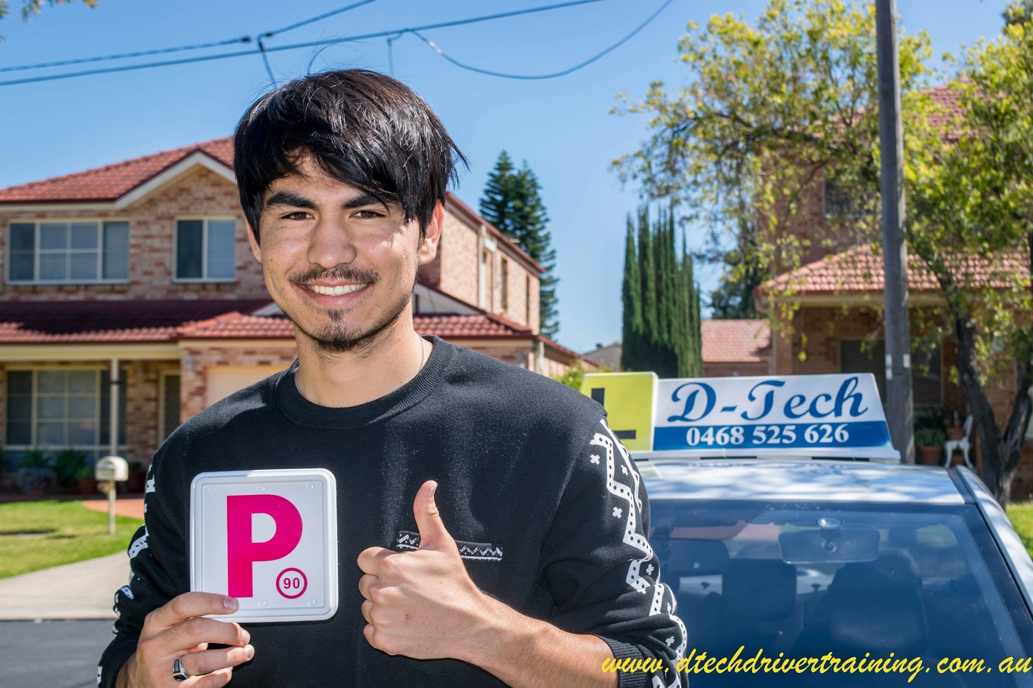 Learner driver celebrating success after driving lessons in Richmond.
