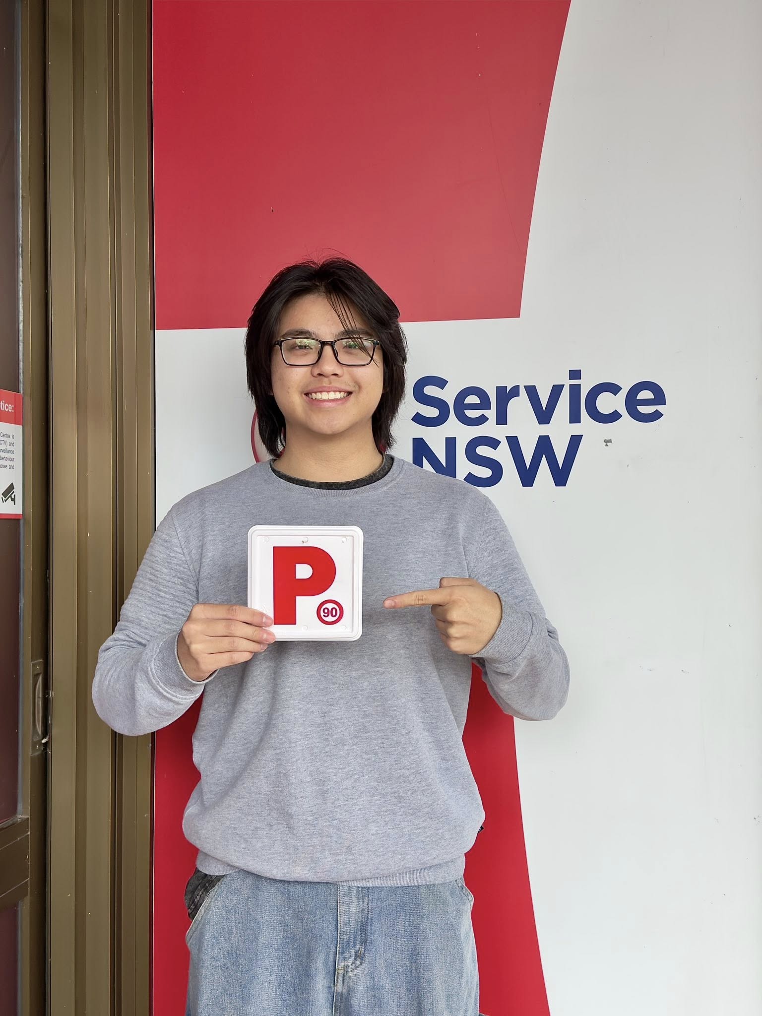 Successful D-Tech driver training student celebrating passing their practical driving test at Blacktown Service NSW registry 1.