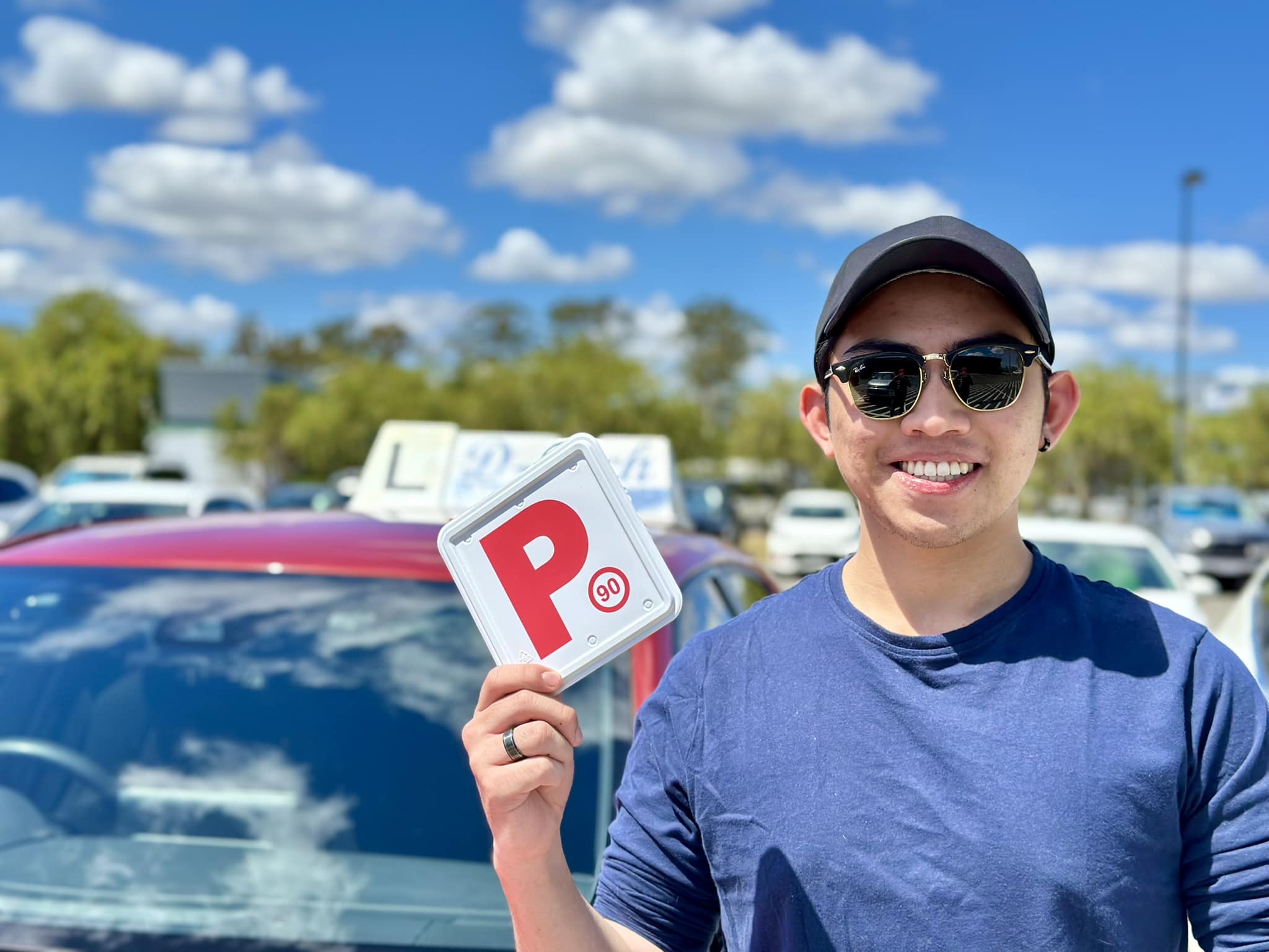 Successful D-Tech driver training student celebrating passing their practical driving test at Richmond Service NSW registry 1.