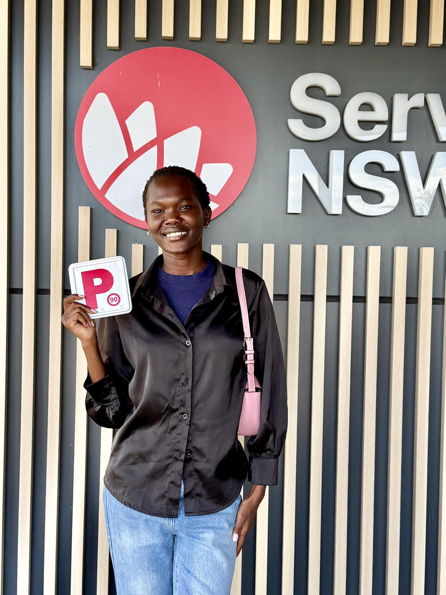 P-plate student celebrating driving test success at St Marys Service NSW tracking branch 2.