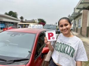 A professional D-Tech driving school instructor delivering a structured driving lesson to a learner driver in Tallawong.